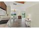 Bright living room with views to dining area with chandelier and sliding glass doors to the exterior at 3146 37Th S Ln # A, St Petersburg, FL 33711
