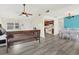 Open living space featuring new floors, a ceiling fan, kitchen and dining area at 3146 37Th S Ln # A, St Petersburg, FL 33711