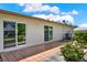 Outdoor patio with tile flooring, sliding glass doors and a landscaped yard at 3146 37Th S Ln # A, St Petersburg, FL 33711