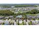 Aerial view of the neighborhood showcasing the community pool and surrounding homes at 32193 Watoga Loop, Wesley Chapel, FL 33543
