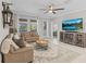 Bright living room featuring hardwood floors, comfortable leather couches, and a large smart TV at 32193 Watoga Loop, Wesley Chapel, FL 33543