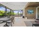 Enjoy the outdoors with this screened patio with travertine tile and a TV for entertainment at 32193 Watoga Loop, Wesley Chapel, FL 33543