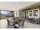 Enjoy the outdoors with this screened patio with travertine tile and a TV for entertainment at 32193 Watoga Loop, Wesley Chapel, FL 33543
