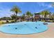 Community splash pad surrounded by lush green landscaping with gazebos and palm trees at 32193 Watoga Loop, Wesley Chapel, FL 33543