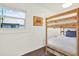 Charming bedroom showcasing wooden bunk beds and natural light from the window at 3230 4Th S Ave, St Petersburg, FL 33712