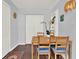 Cozy dining area featuring a wooden table with four chairs and an adjacent shelf at 3230 4Th S Ave, St Petersburg, FL 33712