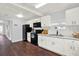 Modern kitchen featuring white cabinets and dark appliances, lots of natural light at 3230 4Th S Ave, St Petersburg, FL 33712