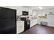Well-lit kitchen featuring sleek, modern appliances and white subway tile backsplash at 3230 4Th S Ave, St Petersburg, FL 33712