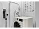 Well-maintained laundry area featuring a modern washing machine and ample space at 3230 4Th S Ave, St Petersburg, FL 33712