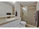Tiled bathroom showcasing a glass-enclosed shower and modern vanity at 3268 39Th S St # A, St Petersburg, FL 33711