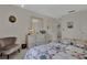Comfortable bedroom with a dresser, mirror, and a cozy chair at 3268 39Th S St # A, St Petersburg, FL 33711