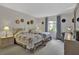 Charming bedroom featuring two twin beds with cozy quilts and ample natural light from the window at 3268 39Th S St # A, St Petersburg, FL 33711