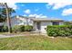 Inviting front entrance to a charming one-story condo with a well-maintained lawn and some shrubbery at 3268 39Th S St # A, St Petersburg, FL 33711