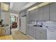 Functional kitchen features neutral cabinets, double sink, and bright lighting, plus a view into the dining area at 3268 39Th S St # A, St Petersburg, FL 33711