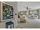 Comfortable living room featuring large windows, soft carpet, and floral patterned sofas at 3268 39Th S St # A, St Petersburg, FL 33711