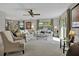 Bright living room featuring plenty of sunlight, plush carpeting, and open access to the dining area at 3268 39Th S St # A, St Petersburg, FL 33711