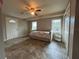 Large bedroom with tile floors, a daybed and natural light from multiple windows at 3625 Windham Dr, Holiday, FL 34691