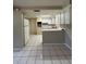 Bright kitchen featuring white cabinetry, tile floors, and a neutral color scheme at 3625 Windham Dr, Holiday, FL 34691