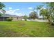 Backyard view, showcasing the white privacy fence and lush greenery at 3908 Douglas Hill Pl, Parrish, FL 34219