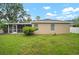 Back exterior view of house showing screen porch and grassy backyard at 3908 Douglas Hill Pl, Parrish, FL 34219