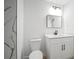 Modern bathroom featuring a toilet, vanity, and shower with stylish marble-look tile at 3908 Douglas Hill Pl, Parrish, FL 34219
