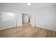 Spacious bedroom boasting wood-look flooring and access to other rooms in the house at 3908 Douglas Hill Pl, Parrish, FL 34219