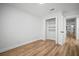 Bedroom showcases wood floors, closet, and is painted with neutral colors at 3908 Douglas Hill Pl, Parrish, FL 34219