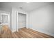 Simple bedroom offers wood floors and a closet for storage at 3908 Douglas Hill Pl, Parrish, FL 34219