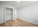A minimalist bedroom featuring wood floors and a closet at 3908 Douglas Hill Pl, Parrish, FL 34219