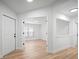 Neutral-toned bedroom featuring modern flooring, crisp white walls, a large window, and bright lighting at 3908 Douglas Hill Pl, Parrish, FL 34219