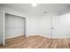 Bedroom featuring wood floors, closet, and entrance to another room at 3908 Douglas Hill Pl, Parrish, FL 34219