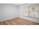 Cozy bedroom showing wood floor and a window at 3908 Douglas Hill Pl, Parrish, FL 34219