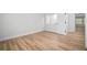 Bedroom featuring wood-look flooring and a view of the hallway and doorways at 3908 Douglas Hill Pl, Parrish, FL 34219