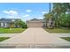 Beautiful single Gathering home featuring manicured landscaping and a concrete driveway under a bright blue sky at 3908 Douglas Hill Pl, Parrish, FL 34219