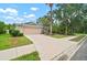 Charming single-story home with a well-manicured lawn and a two-car garage at 3908 Douglas Hill Pl, Parrish, FL 34219