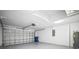 Spacious garage with ample storage and a modern garage door at 3908 Douglas Hill Pl, Parrish, FL 34219