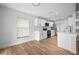 Bright and airy kitchen with white cabinets, stainless appliances, and quartz countertops at 3908 Douglas Hill Pl, Parrish, FL 34219