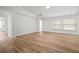 Large living room featuring light wood floors, neutral walls, and natural light at 3908 Douglas Hill Pl, Parrish, FL 34219