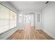 Bright living room with wood floors, white trim, and windows with lots of natural light at 3908 Douglas Hill Pl, Parrish, FL 34219