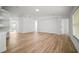 Open concept living room featuring wood-look flooring and an abundance of natural light at 3908 Douglas Hill Pl, Parrish, FL 34219
