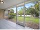 View from the screened in porch, showcasing the backyard at 3908 Douglas Hill Pl, Parrish, FL 34219