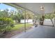 View of backyard from the screened-in patio with tiled floor at 3908 Douglas Hill Pl, Parrish, FL 34219