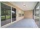View of the screened porch with tile flooring and an outdoor view at 3908 Douglas Hill Pl, Parrish, FL 34219
