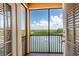 Balcony view featuring beautiful pond, fountain, mangroves, and St. Petersburg skyline at 4345 Bayside Village Dr # 303, Tampa, FL 33615