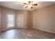 Neutral bedroom featuring tile floors, ceiling fan and an exterior door with a small balcony at 4345 Bayside Village Dr # 303, Tampa, FL 33615