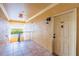 Hallway to unit 303 with tiled floors and a view to the outside waterway with mangroves at 4345 Bayside Village Dr # 303, Tampa, FL 33615