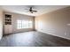 Bright living room features neutral paint, tiled floors, ceiling fan and access to a balcony at 4345 Bayside Village Dr # 303, Tampa, FL 33615