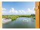 Scenic view of the pond with a fountain and mangroves and skyline of St. Petersburg in distance at 4345 Bayside Village Dr # 303, Tampa, FL 33615