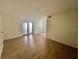 Bright living room with great wood-look floors and access to a screened in patio at 4611 W North B St # 125, Tampa, FL 33609