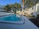 Inviting community pool surrounded by lush landscaping and well-maintained buildings offering a refreshing retreat at 4611 W North B St # 125, Tampa, FL 33609